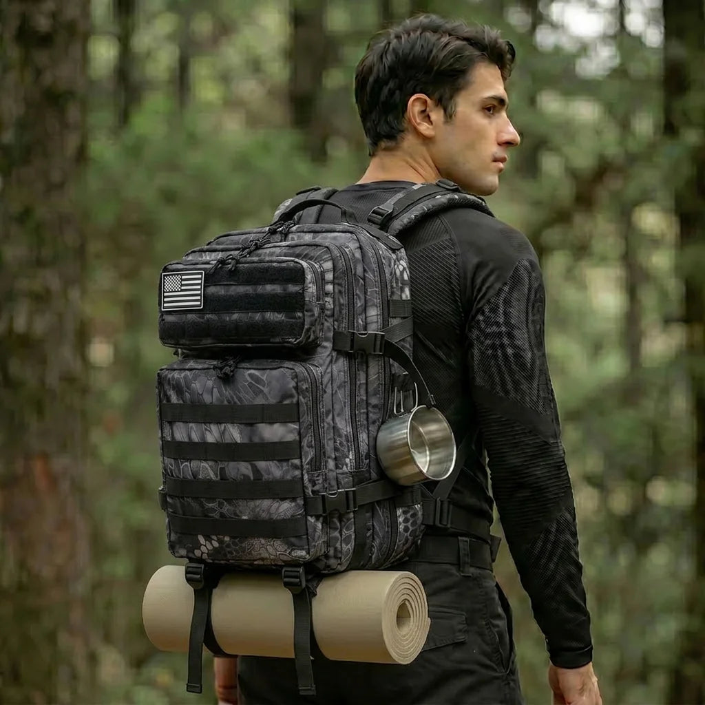 Man wearing the Black 45L outdoor backpack with MOLLE-style storage and rolled gear secured beneath the pack.