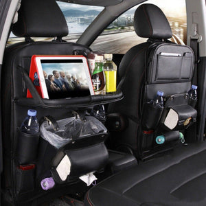 Black seat-back organizer with folding tray, bottle holders and hidden trash pocket in back seat