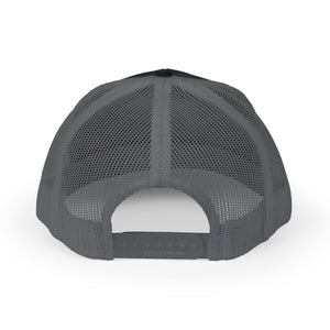 Reel Cool Granddaughter embroidered trucker cap, back view showing snapback closure, black with charcoal mesh back