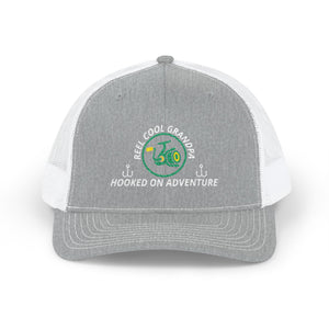 Reel Cool Grandpa embroidered trucker cap, front view, heather grey front with white mesh back